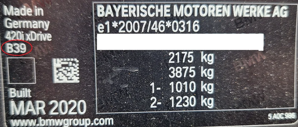 BMW vehicle ID plate from a 420i xDrive, with the paint code B39 circled under the model name
